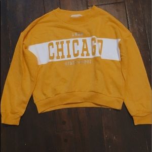 A crop top in yellow White and silver :)